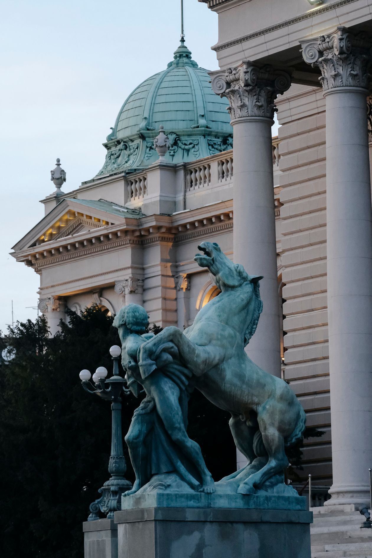 Statue and the National Assembly building in Belgrade