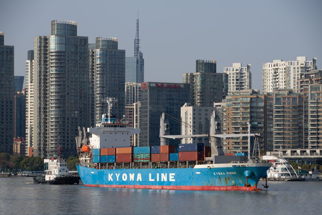 Container ship and an urban waterfront skyline