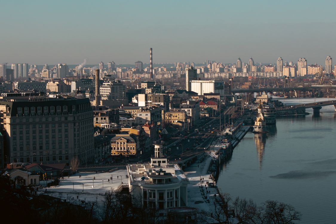 Kyiv skyline and the Dnipro River at dusk
