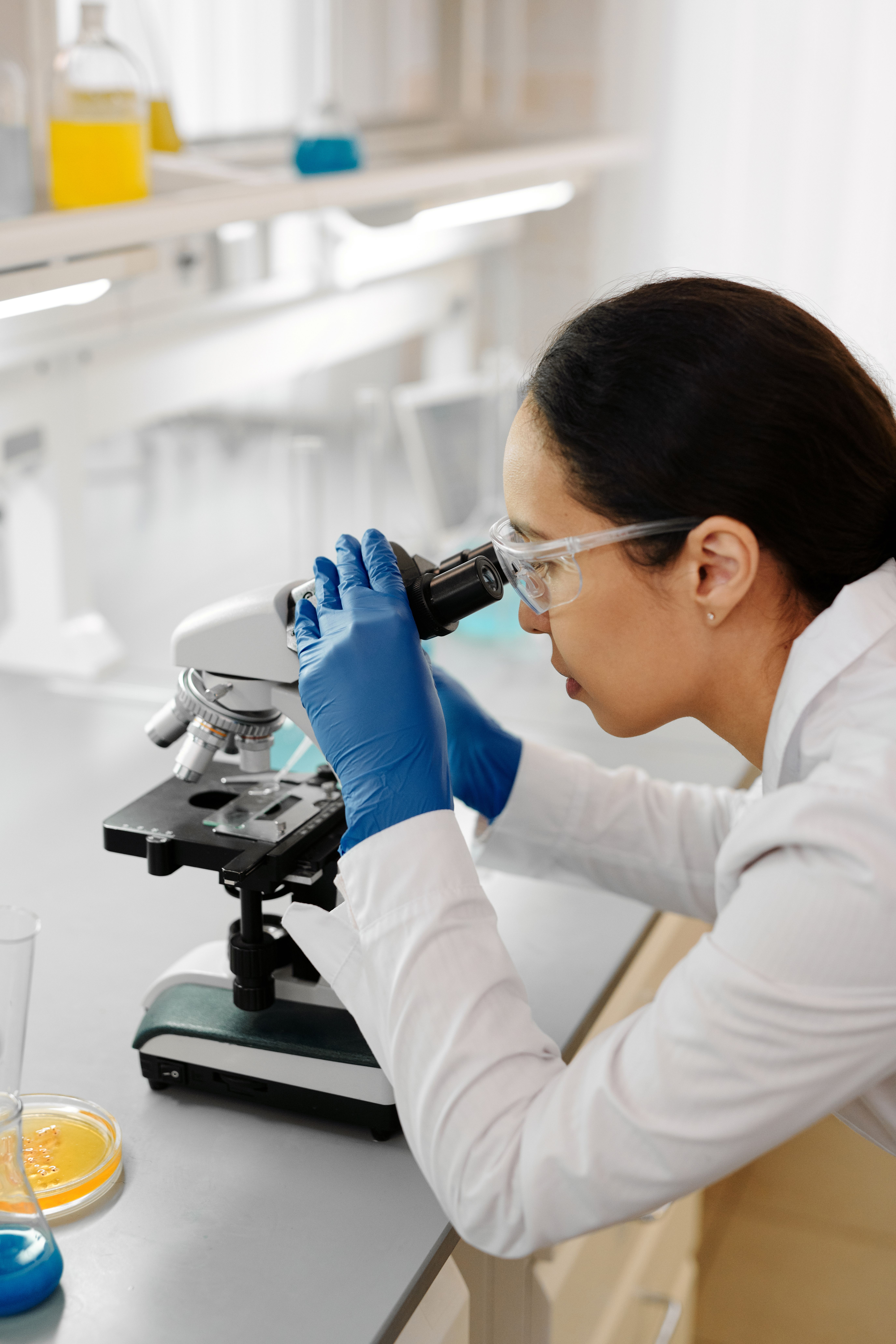 Scientist using a microscope; illustrative file photograph, not Silence Therapeutics or the reported trial