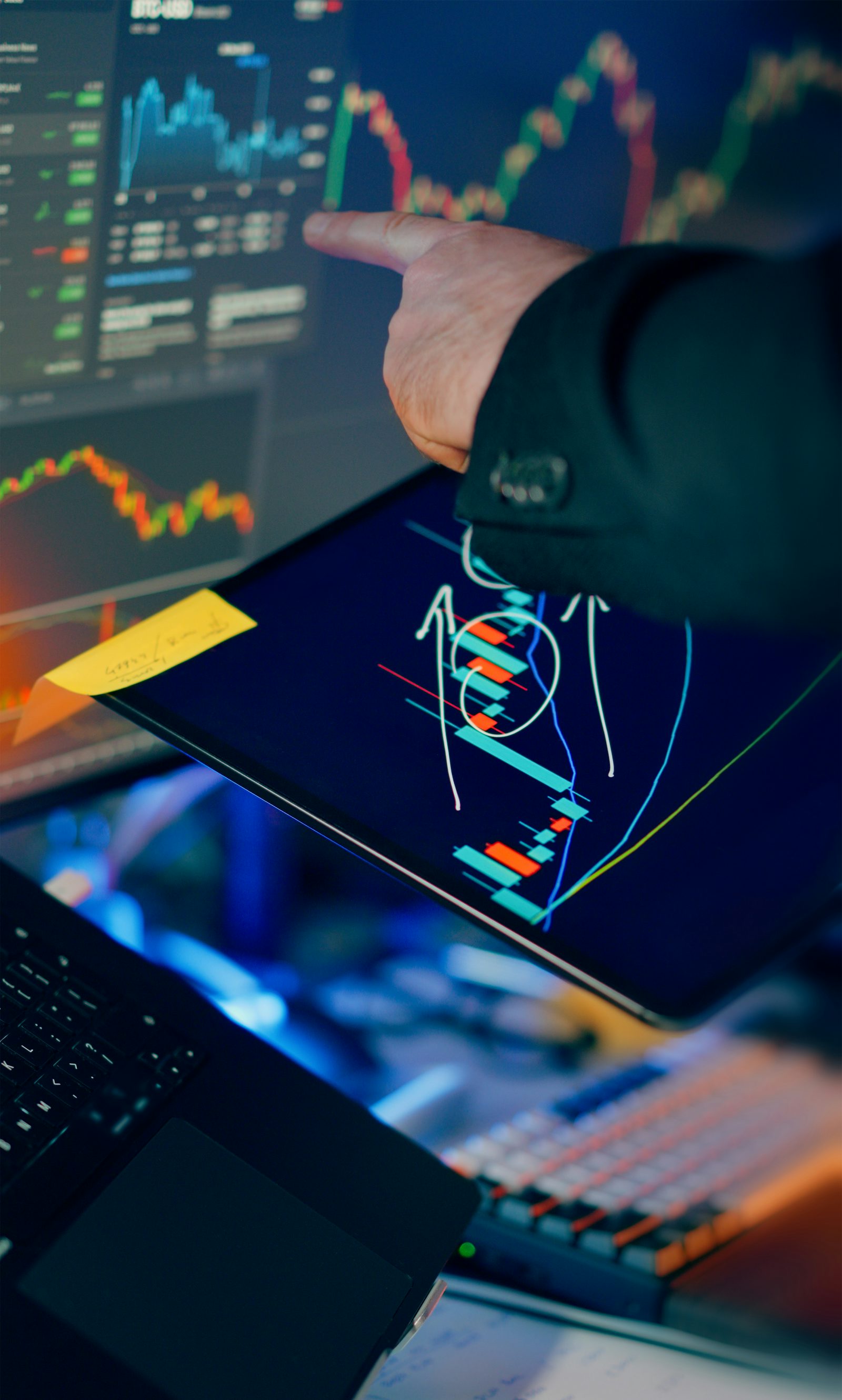 Financial trading screens showing market charts